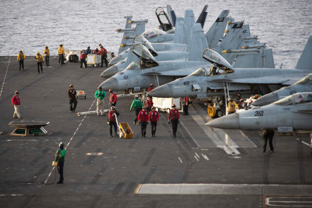 231106-N-SK336-1314 F/A-18 Super Hornets, attached to Carrier Air Wing (CVW) 8, prepare for flight operations on the flight deck of the world’s largest aircraft carrier USS Gerald R. Ford (CVN) 78 in the Mediterranean Sea, Nov. 6, 2023. The Gerald R. Ford Carrier Strike Group is currently operating in the Eastern Mediterranean Sea. The U.S. maintains forward-deployed, ready, and postured forces to deter aggression and support security and stability around the world. (U.S. Navy photo by Mass Communication Specialist 2nd Class Jennifer Newsome)